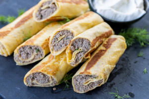 Blinchiki with Meat with serving tray.