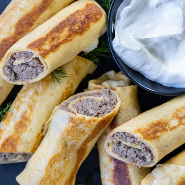 Blinchiki with Meat on a serving tray.