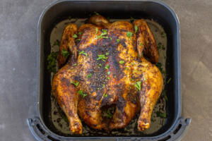Air Fryer Whole Chicken in a basket.