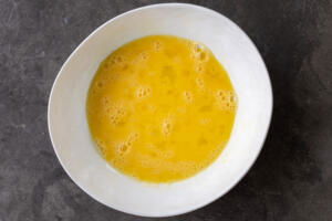 Whisked eggs in a bowl.