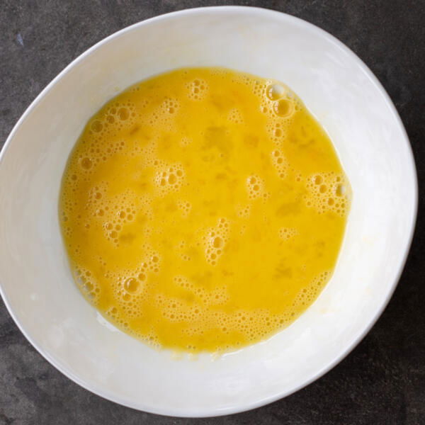 Whisked eggs in a bowl.