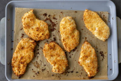 Baked Baked Chicken Cutlets on a baking sheet.