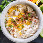 Crack Dip in a bowl with topping.