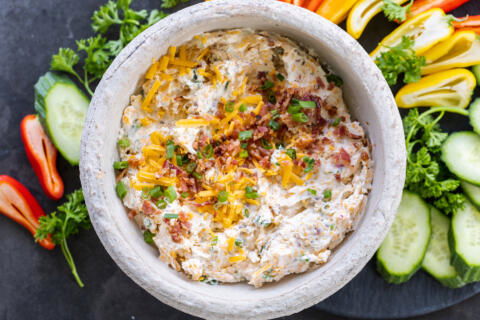 Crack Dip in a bowl with topping.