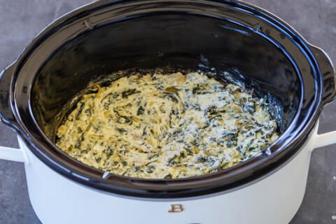 Spinach Artichoke Dip in a crock pot.