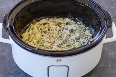 Spinach Artichoke Dip in a crock pot.
