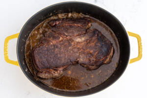 Broth and beef add to the pot.