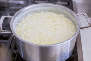 Milk with cream in a pot.