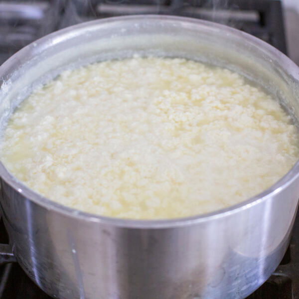 Milk with cream in a pot.