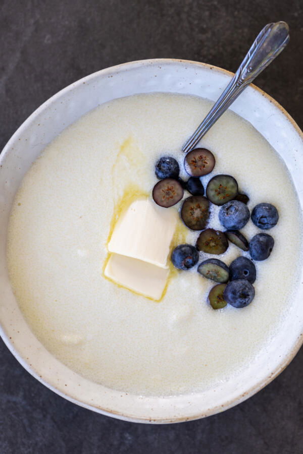 Semolina Porridge in a bowl with berried and butter.