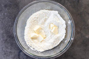 Flour, salt and butter in a bowl.