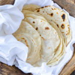 Wrapped Sourdough Flour Tortillas in a towel.