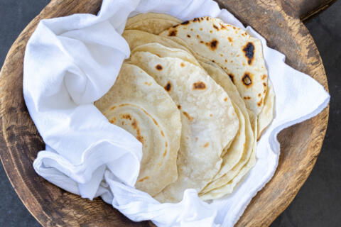Wrapped Sourdough Flour Tortillas in a towel.