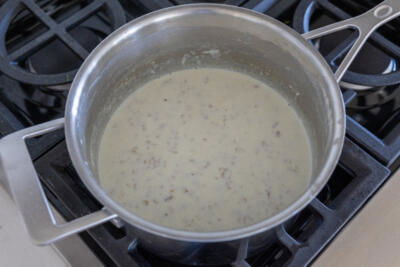 Cooked steel cut oats in a pot.