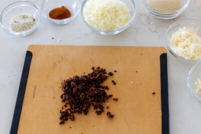 Sun Dried tomatoes on a cutting board.