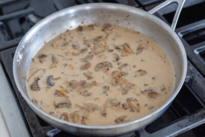 Creamy mushroom sauce in a pan.