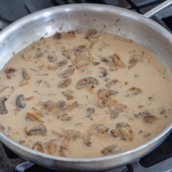 Creamy mushroom sauce in a pan.