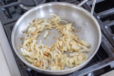 Sautéed onions in a pan.