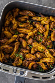 Air Fryed chicken in an a basket.