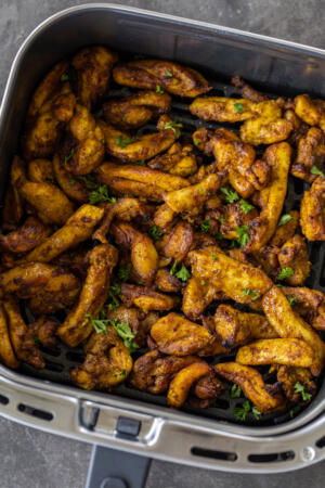 Air Fryed chicken in an a basket.