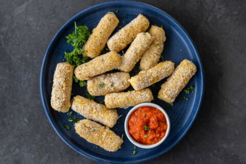 Plated Air Fryer Mozzarella Sticks.