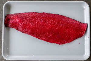 Pink salmon on a cutting board.