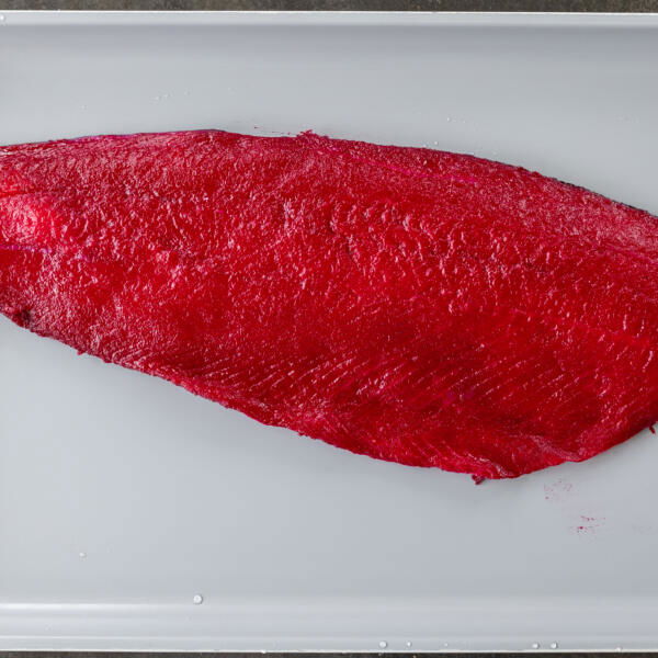 Pink salmon on a cutting board.