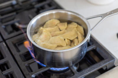 Varenyky boiling in water.