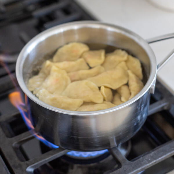 Varenyky boiling in water.