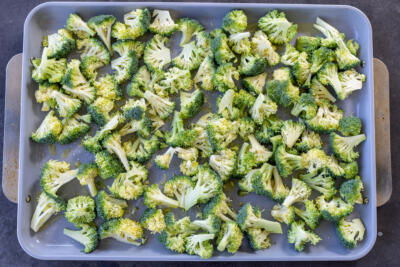 Broccoli on a baking sheet.