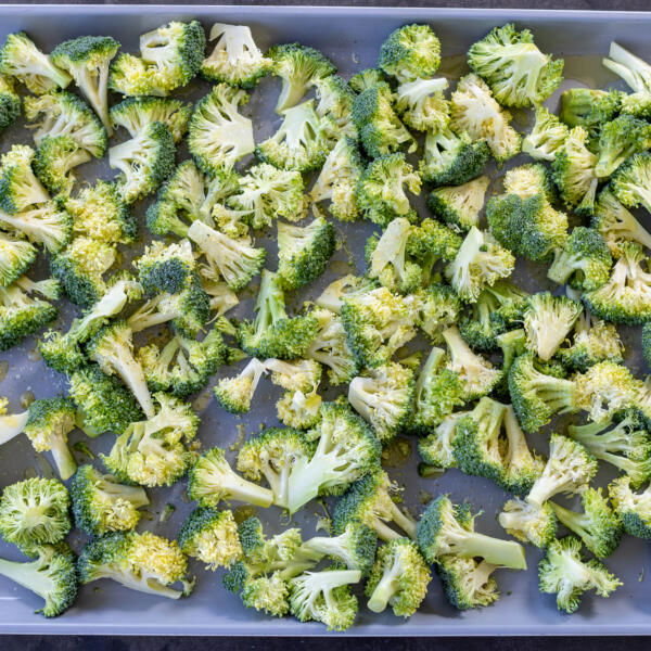 Broccoli on a baking sheet.