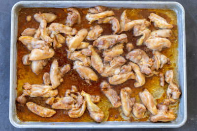 Baked chicken on a pan.