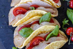 Baked Cottage Cheese Flatbread with turkey tomatoes and herbs.