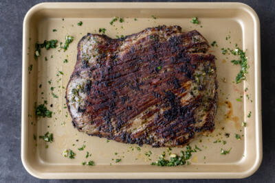 Cooked Chimichurri Steak on a baking sheet.