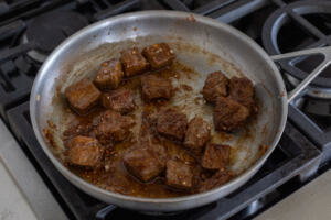 Steak tossed with garlic butter.