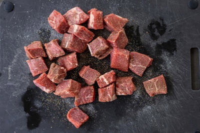 Sliced steak with salt and pepper.