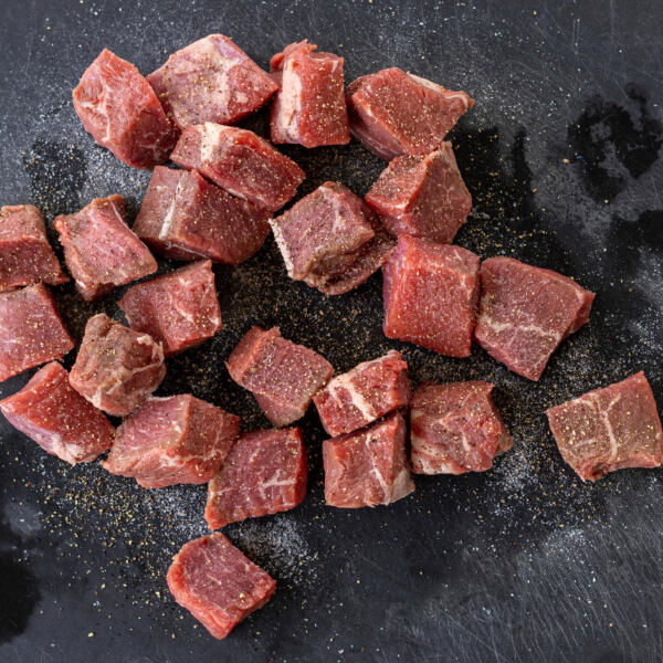 Sliced steak with salt and pepper.