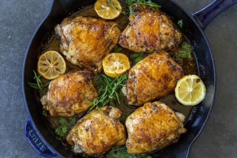 Herb Roasted Chicken Thighs in a baking pan.