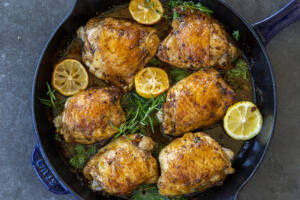 Herb Roasted Chicken Thighs in a baking pan.