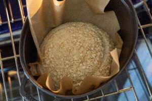 Oat Sourdough Bread in a baking pan.