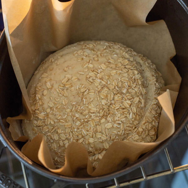 Oat Sourdough Bread in a baking pan.