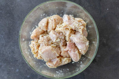 Garlic Parmesan Chicken in a bowl with marinade.