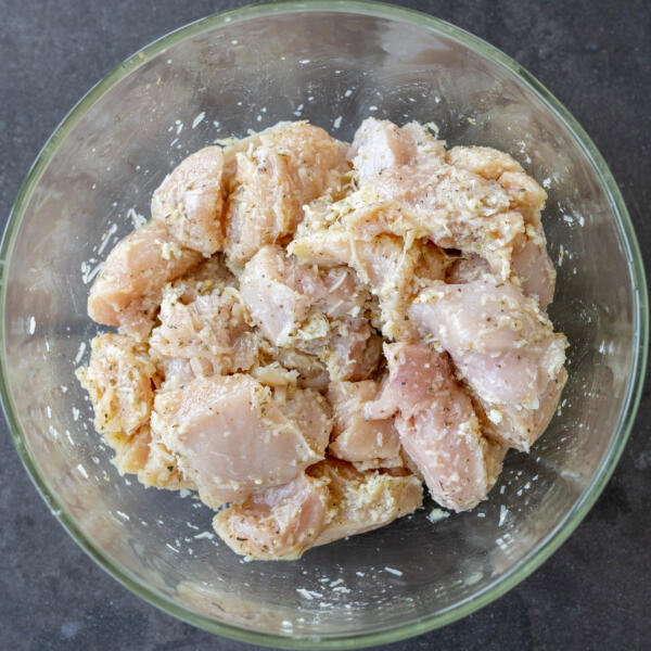 Garlic Parmesan Chicken in a bowl with marinade.