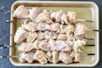 Garlic Parmesan Chicken on a skewer.