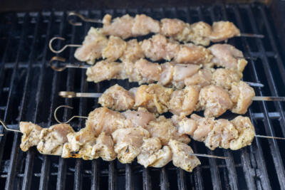 Garlic Parmesan Chicken skewers grilling.