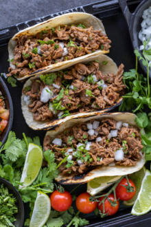 Shaved Beef Tacos with veggies and other toppings.