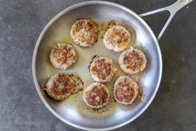 Browned tefteli in a pan.