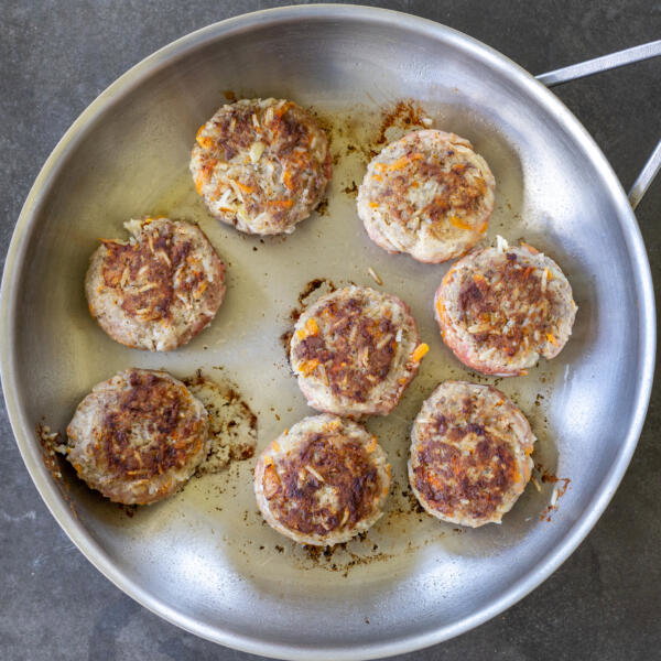 Browned tefteli in a pan.