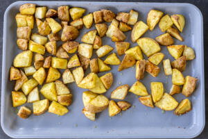 Roasted potatoes on a baking sheet.