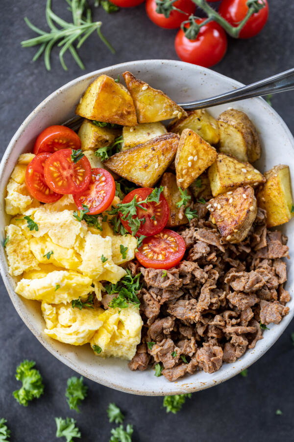 Make-Ahead Breakfast Bowls with veggies and herbs.